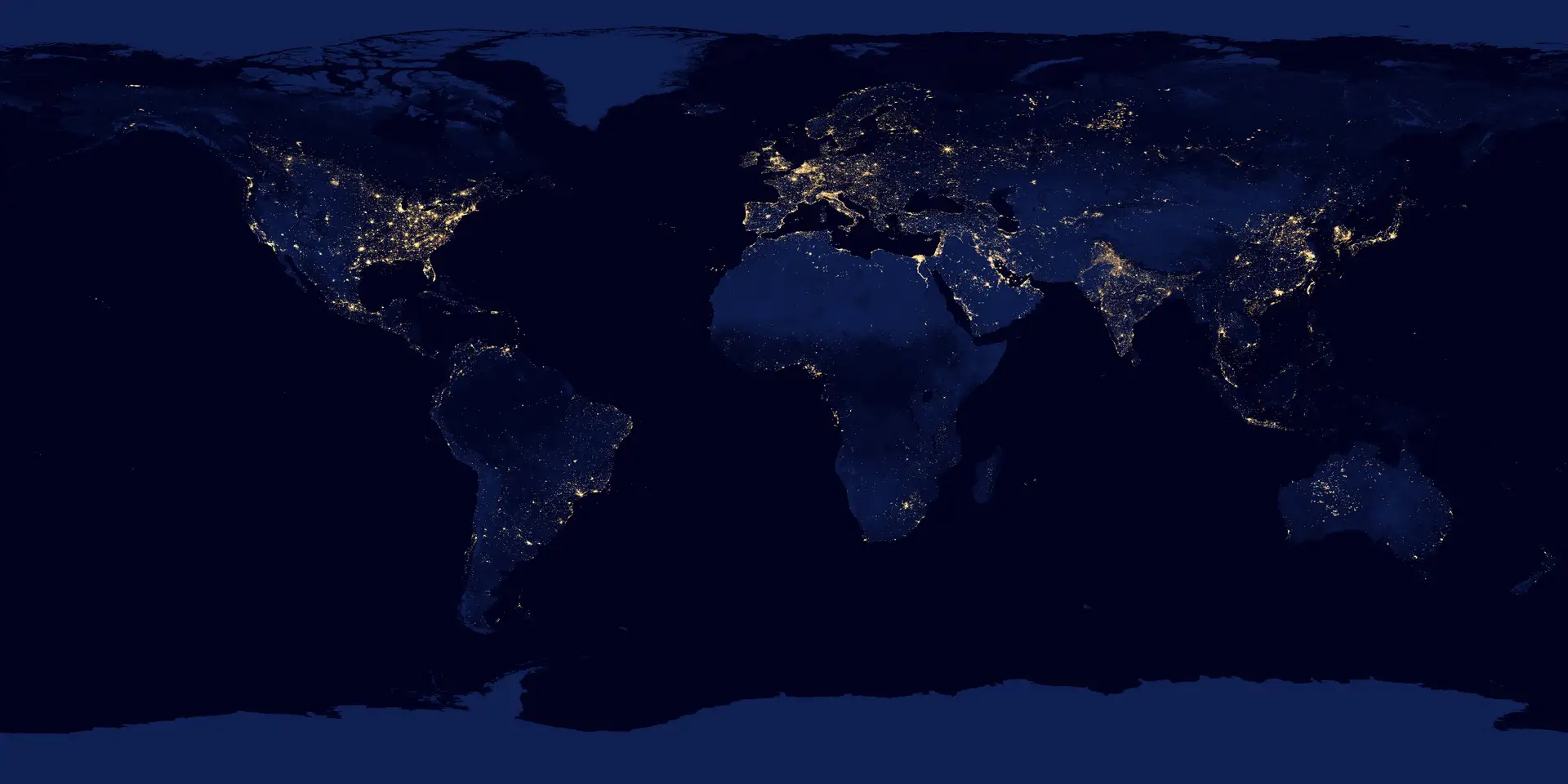 Earth at night, with bright networks of cities separated by large dark regions